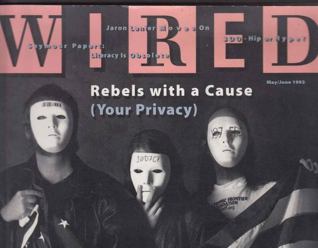 Wired magazine cover, May/June 1993. The three figures are the cypherpunks Tim May, Eric Hughes, and John Gilmore — the masks are theirs.
